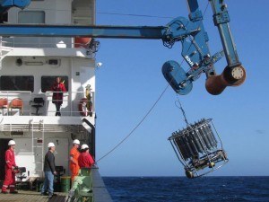 Bringing the CTD (an instrument which measures conductivity and temperature of seawater and depth, and collects water samples as it comes up) back on board the ship in slightly rough seas (hence, the swinging).   